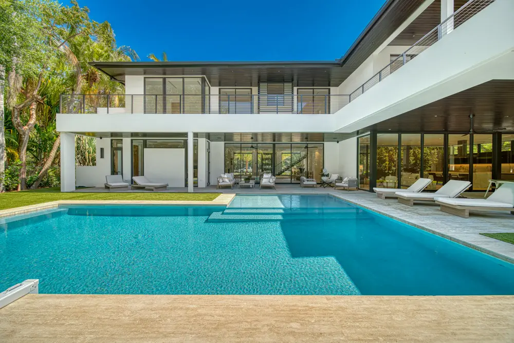 Pool and rear exterior of a modern home